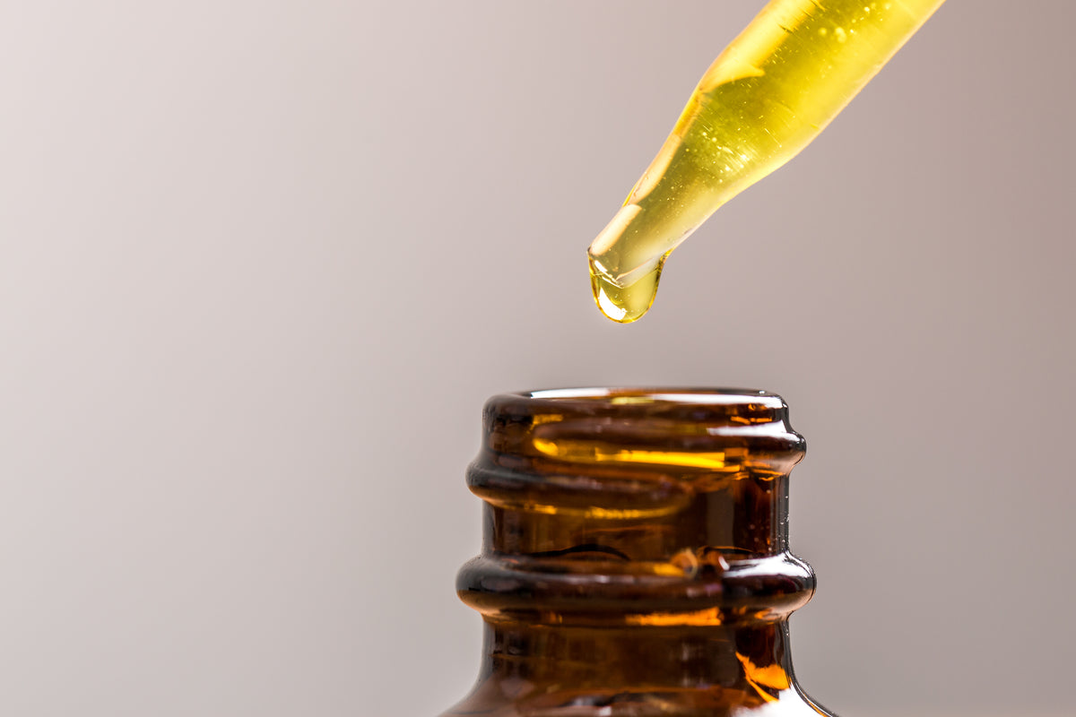 Oil dripping into jar